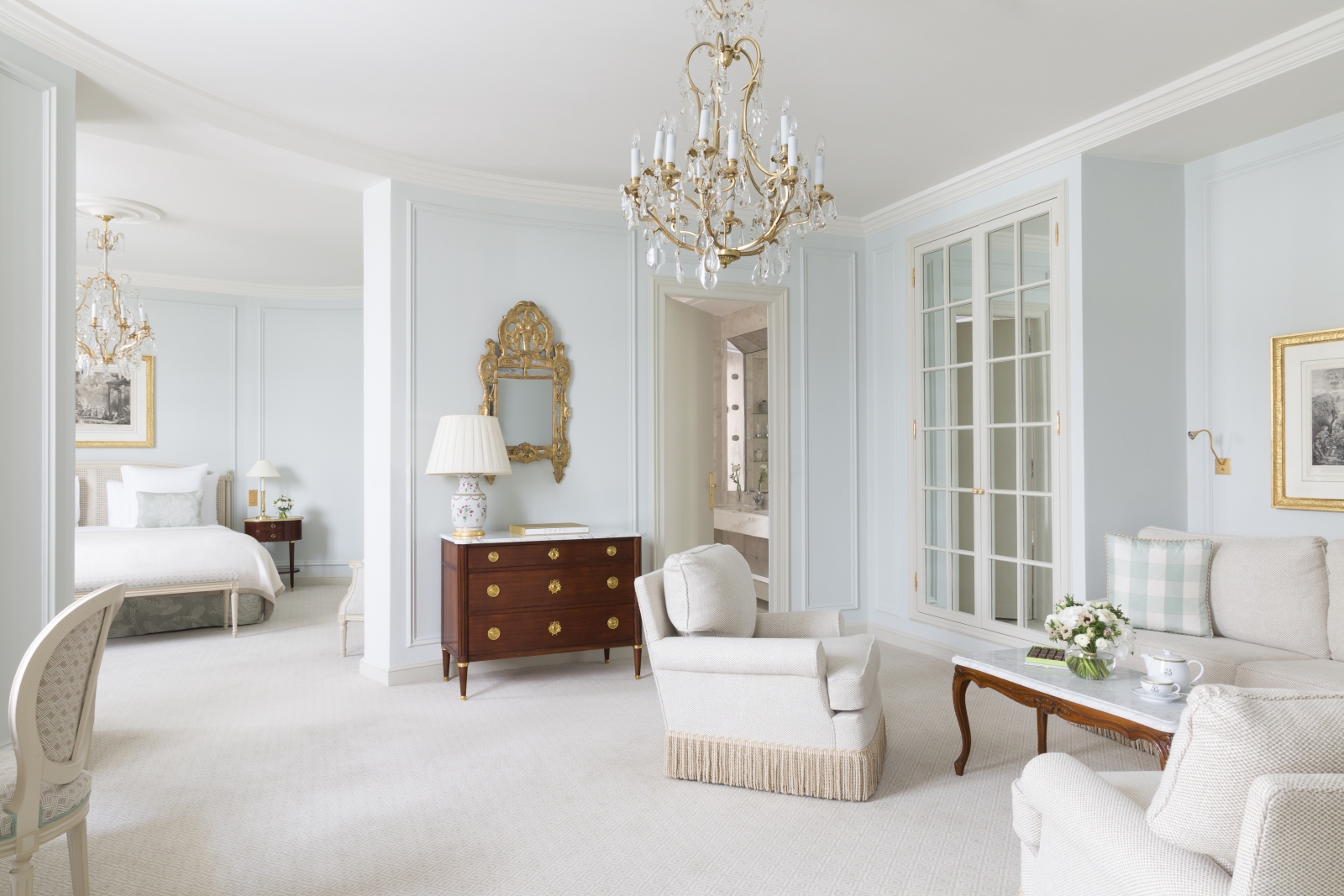 Deluxe Junior Suite with bedroom, living room and bathroom, with a white and dark wood colour scheme