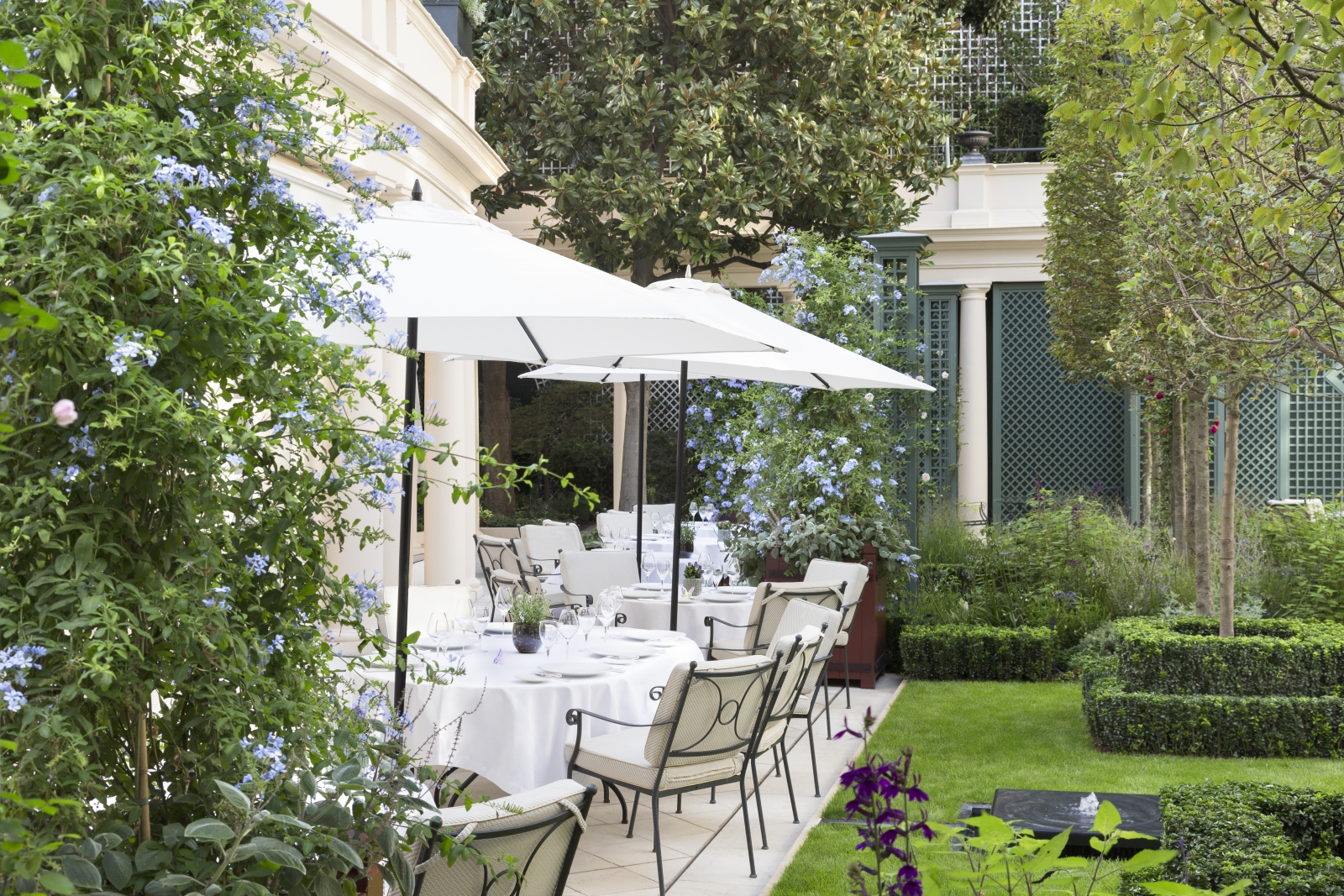 Terrace dining in the gardens of luxury hotel Le Bristol in Paris, France