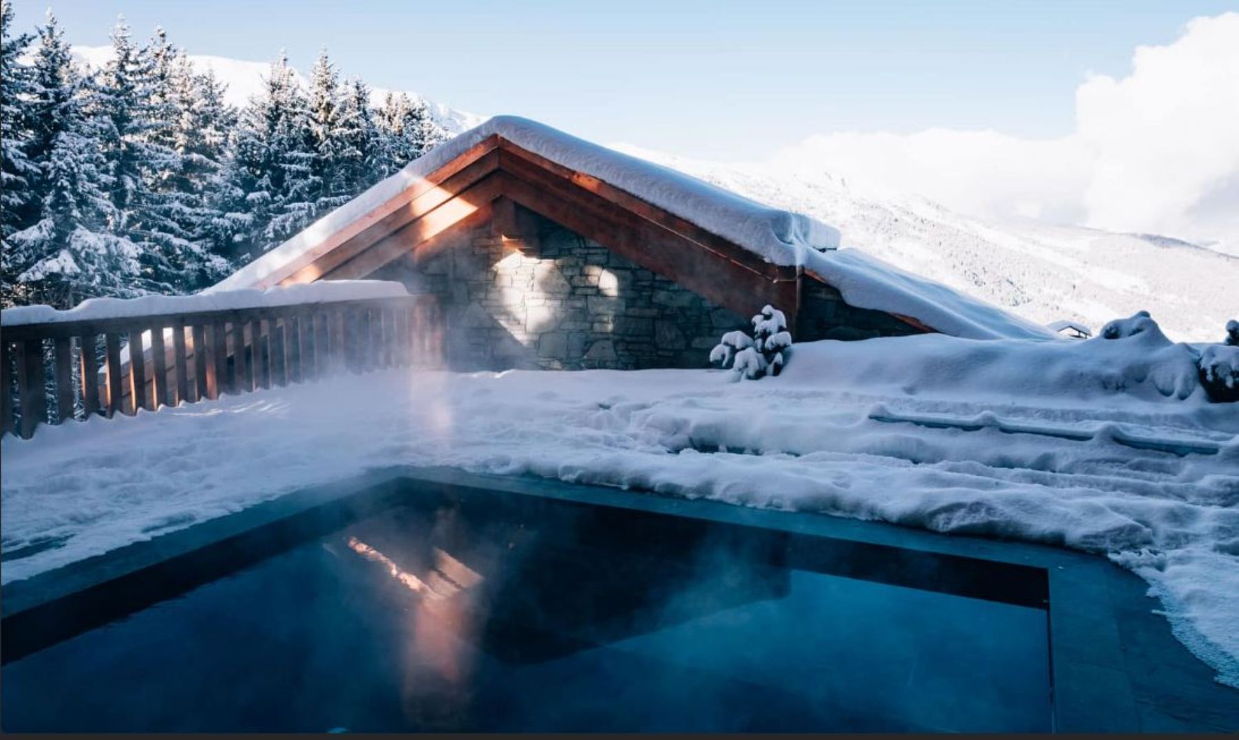 Outdoor swimming pool at Le CouCou hotel in Meribel