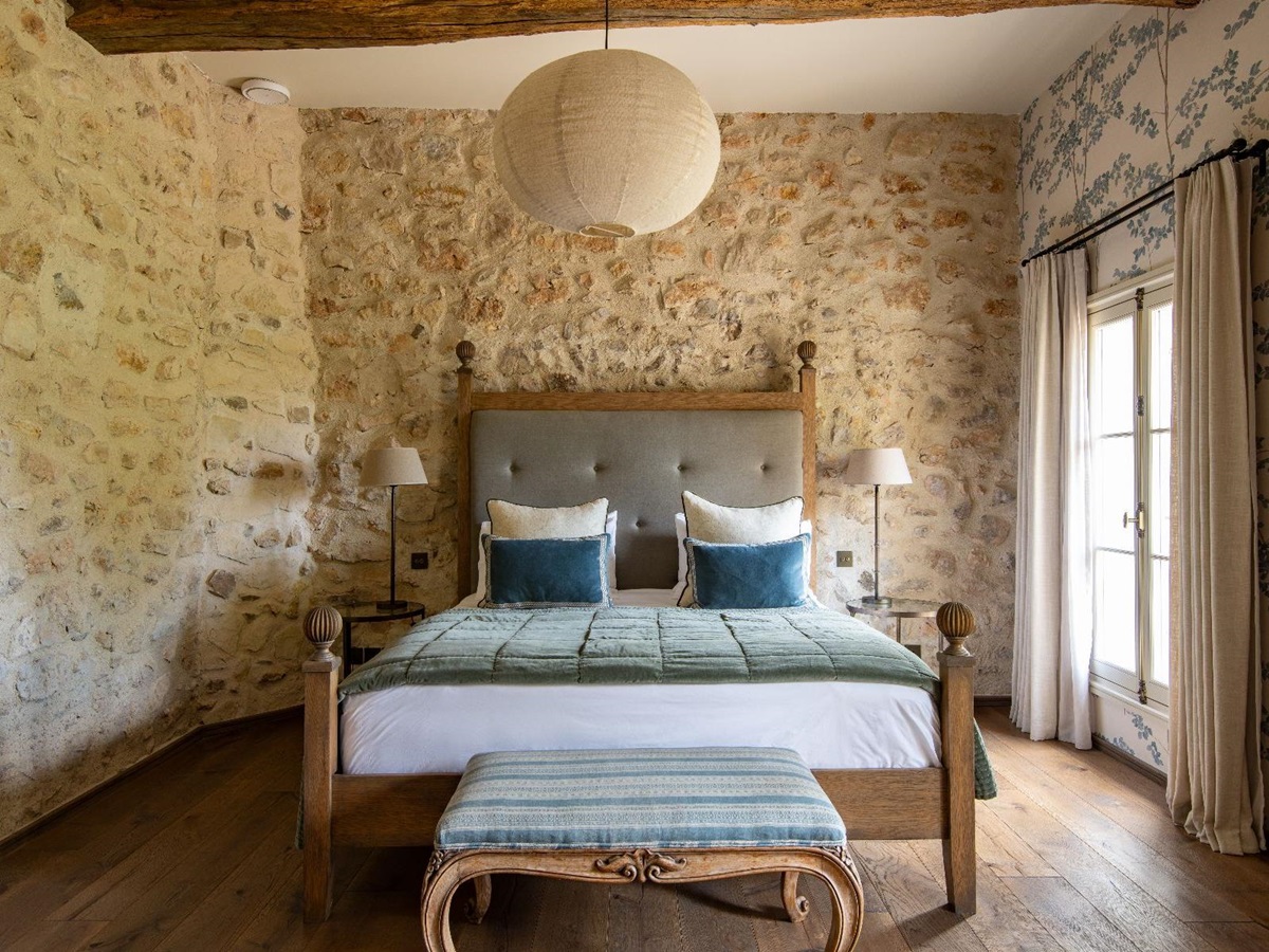 Queen bed in master bedroom at Bastide Notre Dame in Cote d'Azur, France