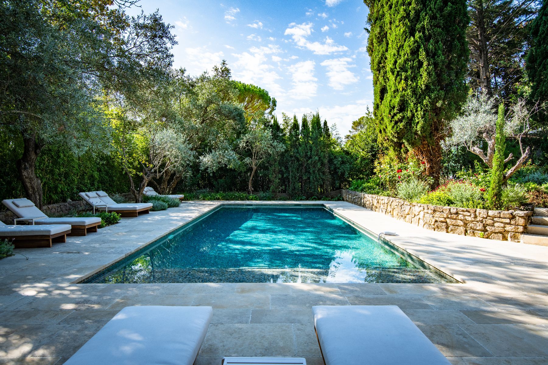 Sunbeds by the pool at Bastide Notre Dame in Cote d'Azur, France