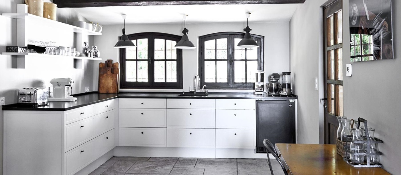 Kitchen with white units at Villa Les Hauts de Vence in the Cote dAzur