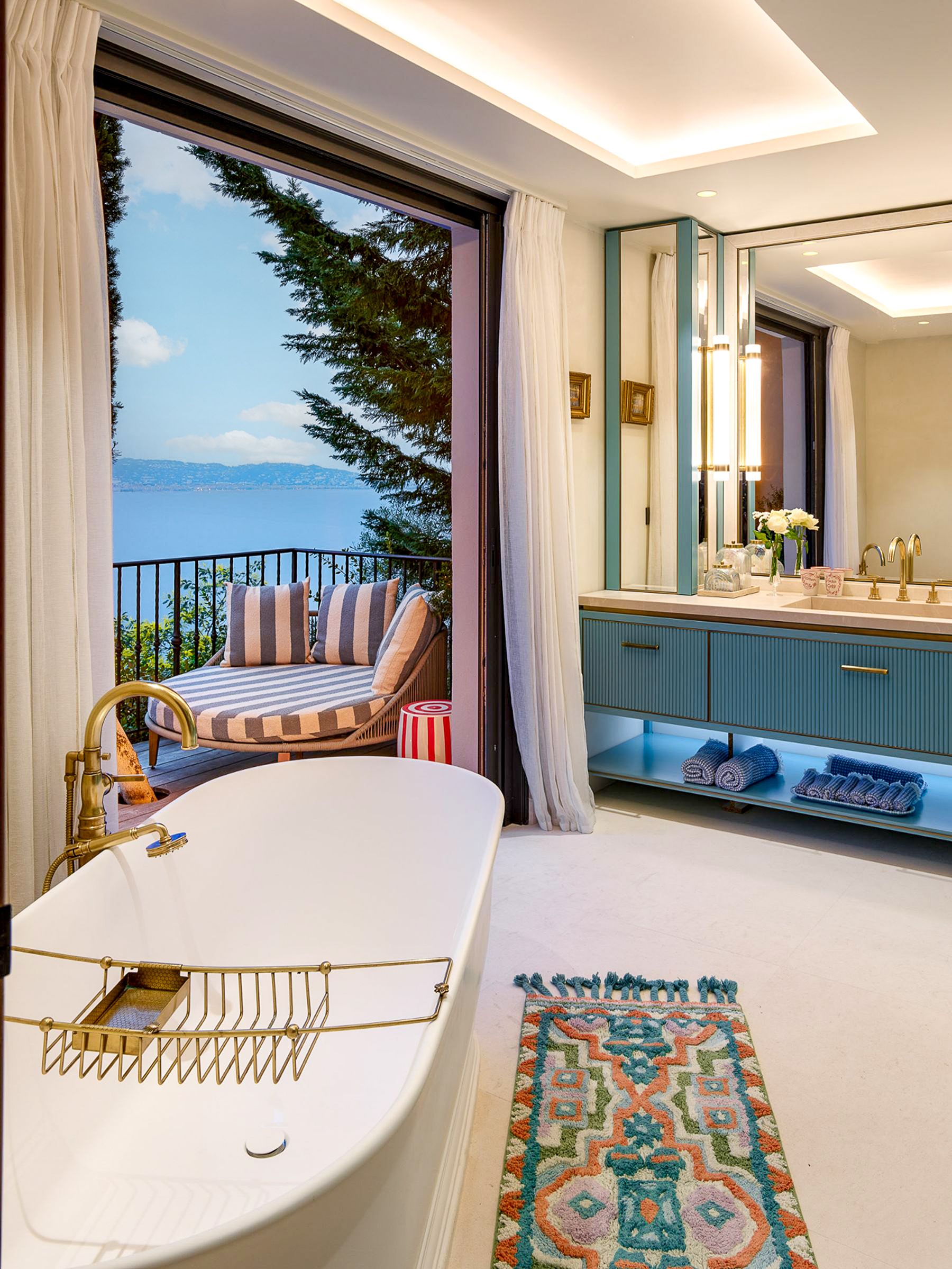 Bathroom with bath and balcony overlooking the sea at Villa Calade in Cote d'Azur, France