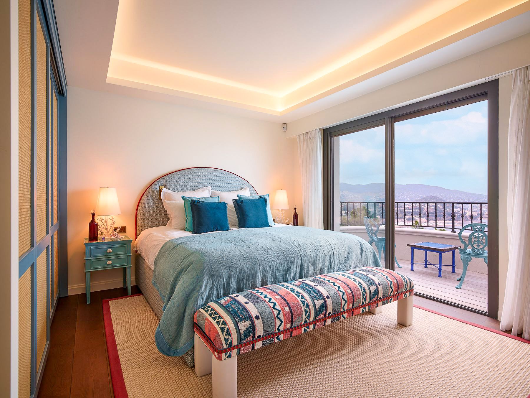 Bedroom with double bed and balcony overlooking the sea at Villa Calade in Cote d'Azur, France