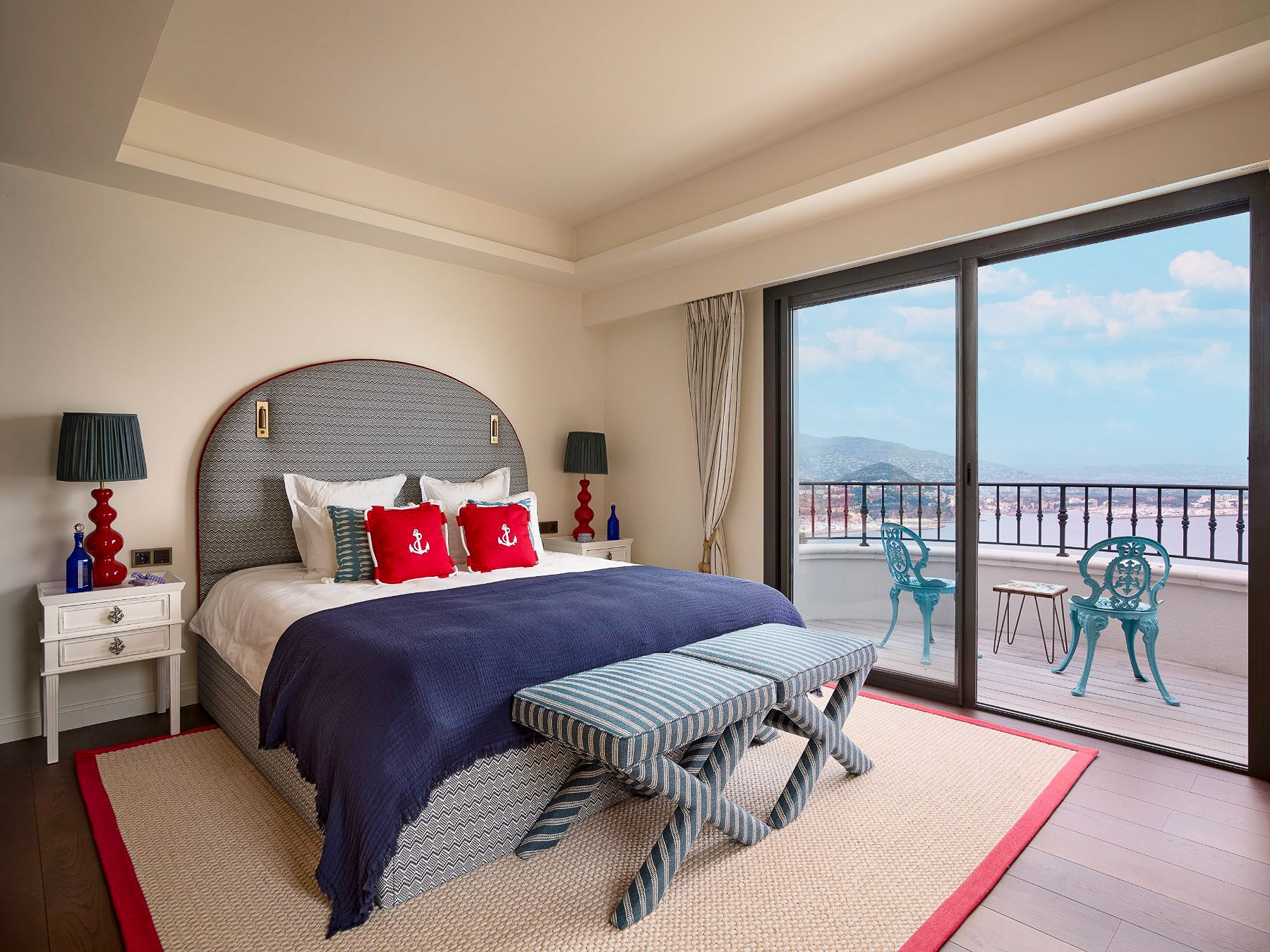 Bedroom with double bed and balcony overlooking the sea at Villa Calade in Cote d'Azur, France