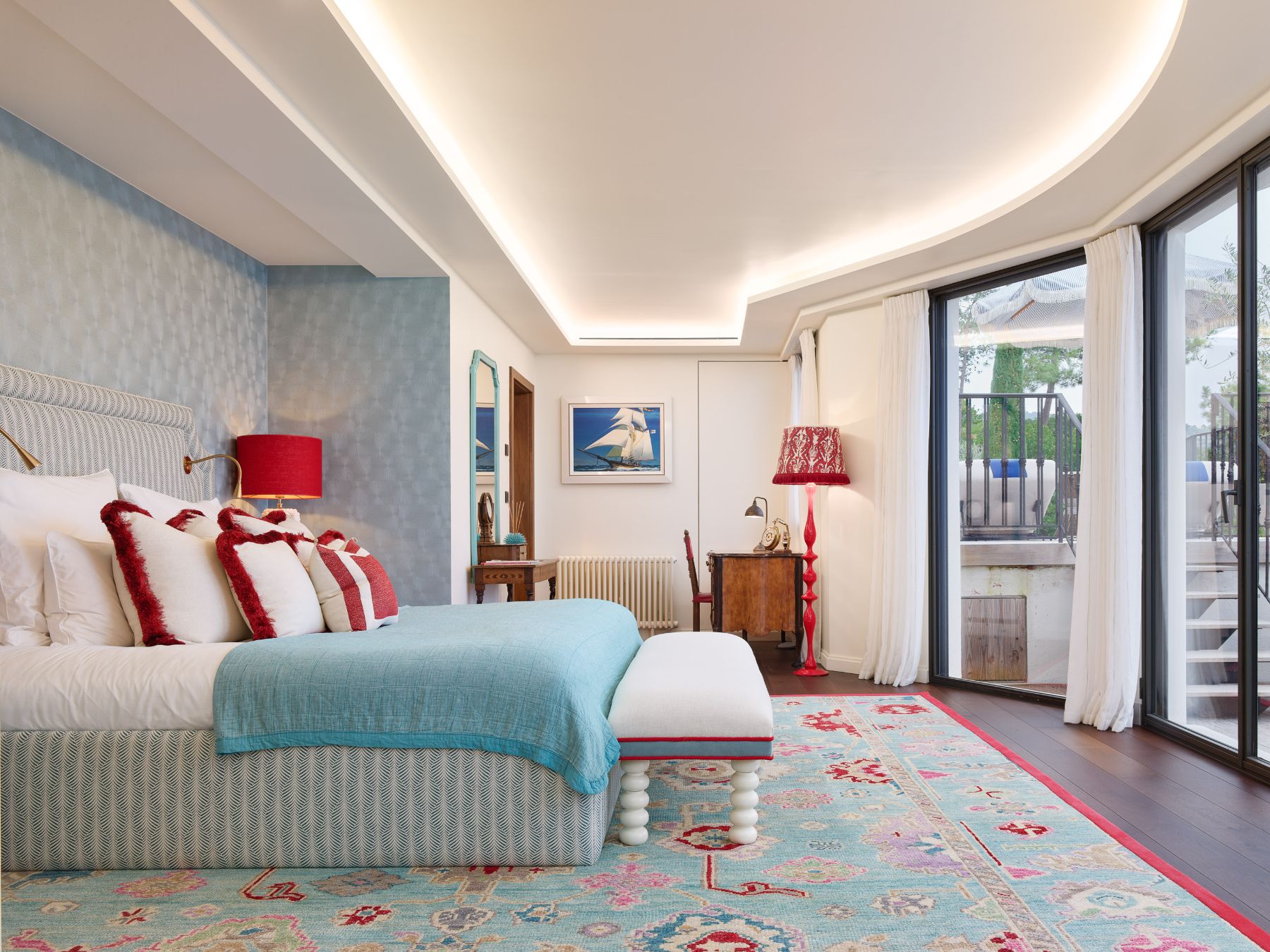 Double bedroom with red lamps and sea view at Villa Calade in Cote d'Azur