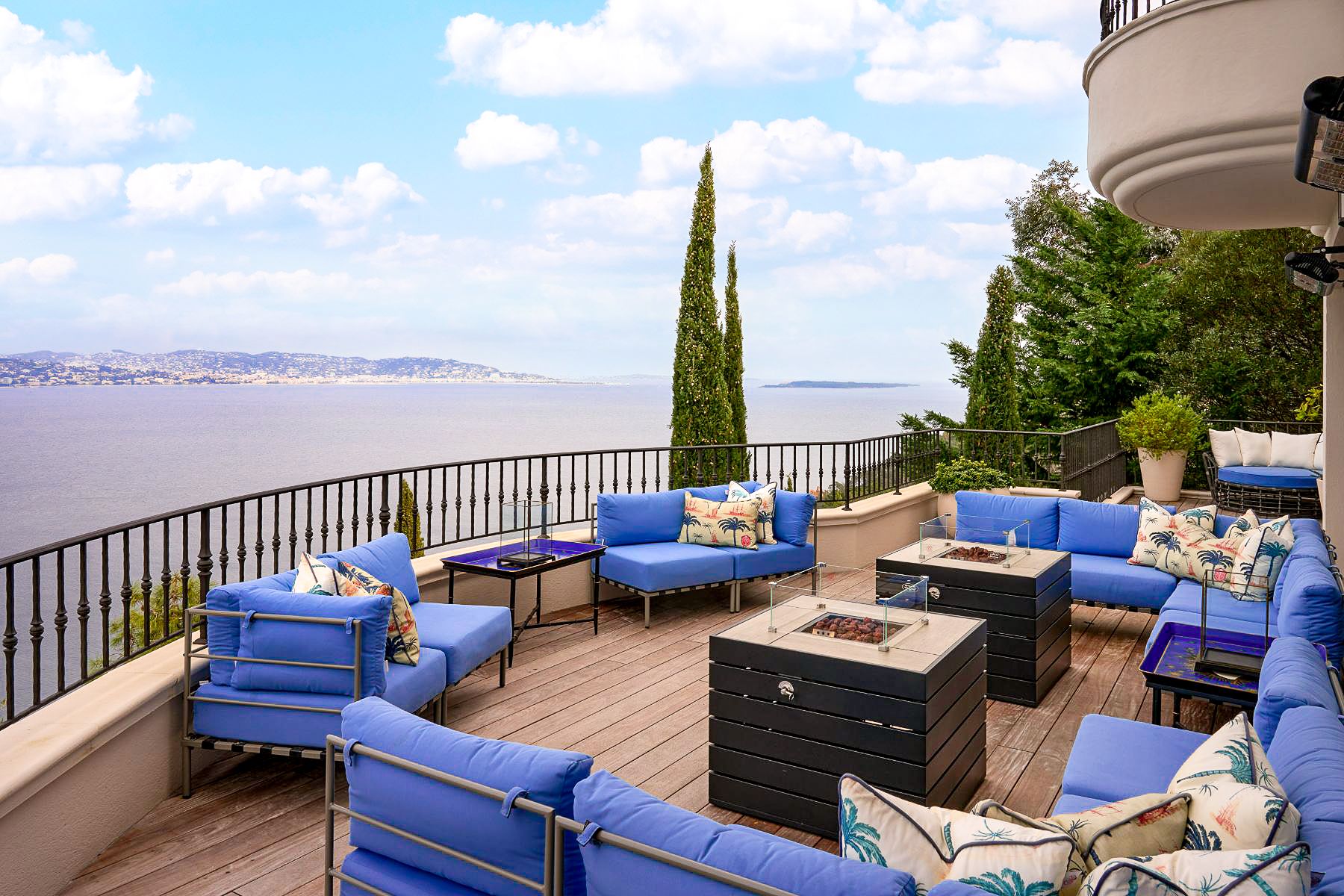 Outdoor seating on balcony overlooking the sea at Villa Calade in Cote d'Azur, France