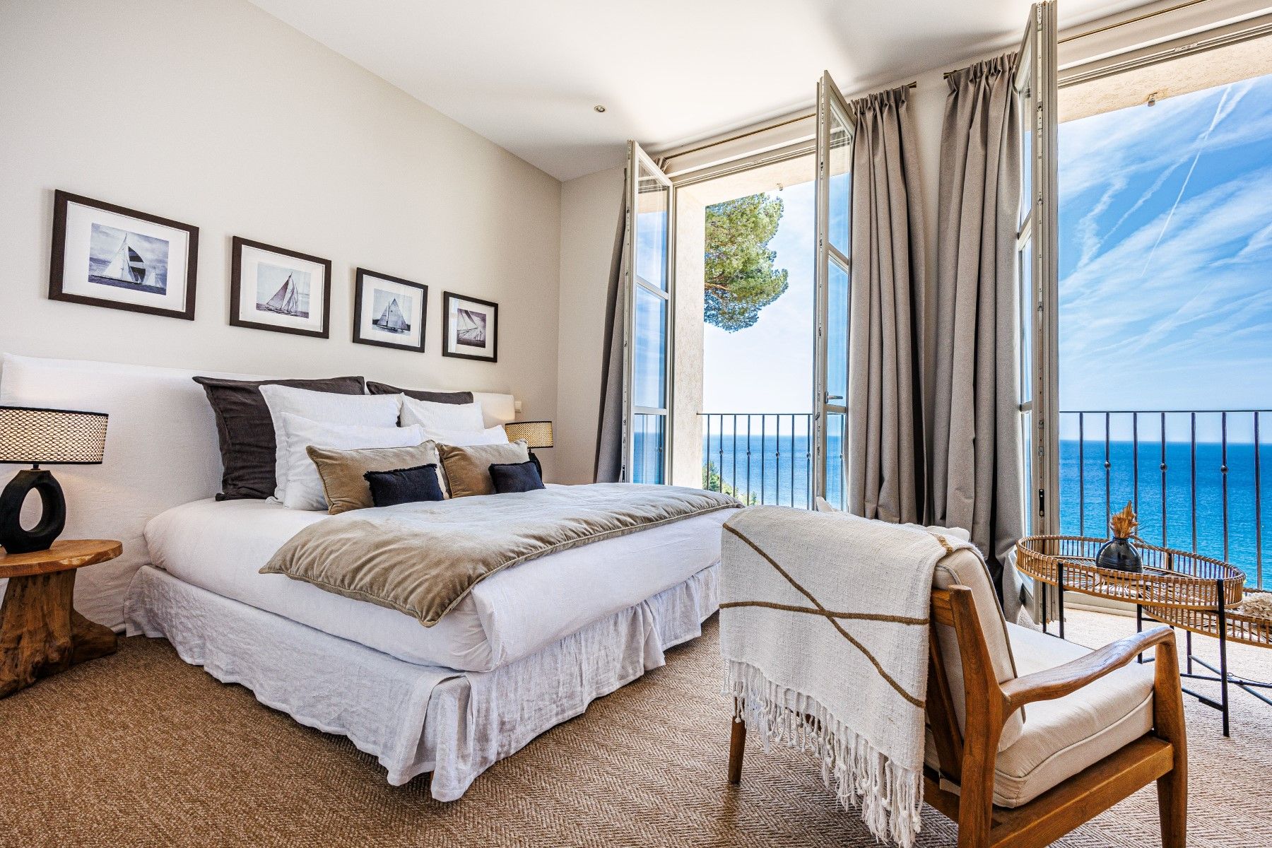 Double bedroom with one chair and double window view at Villa Florie in Côte d'Azur