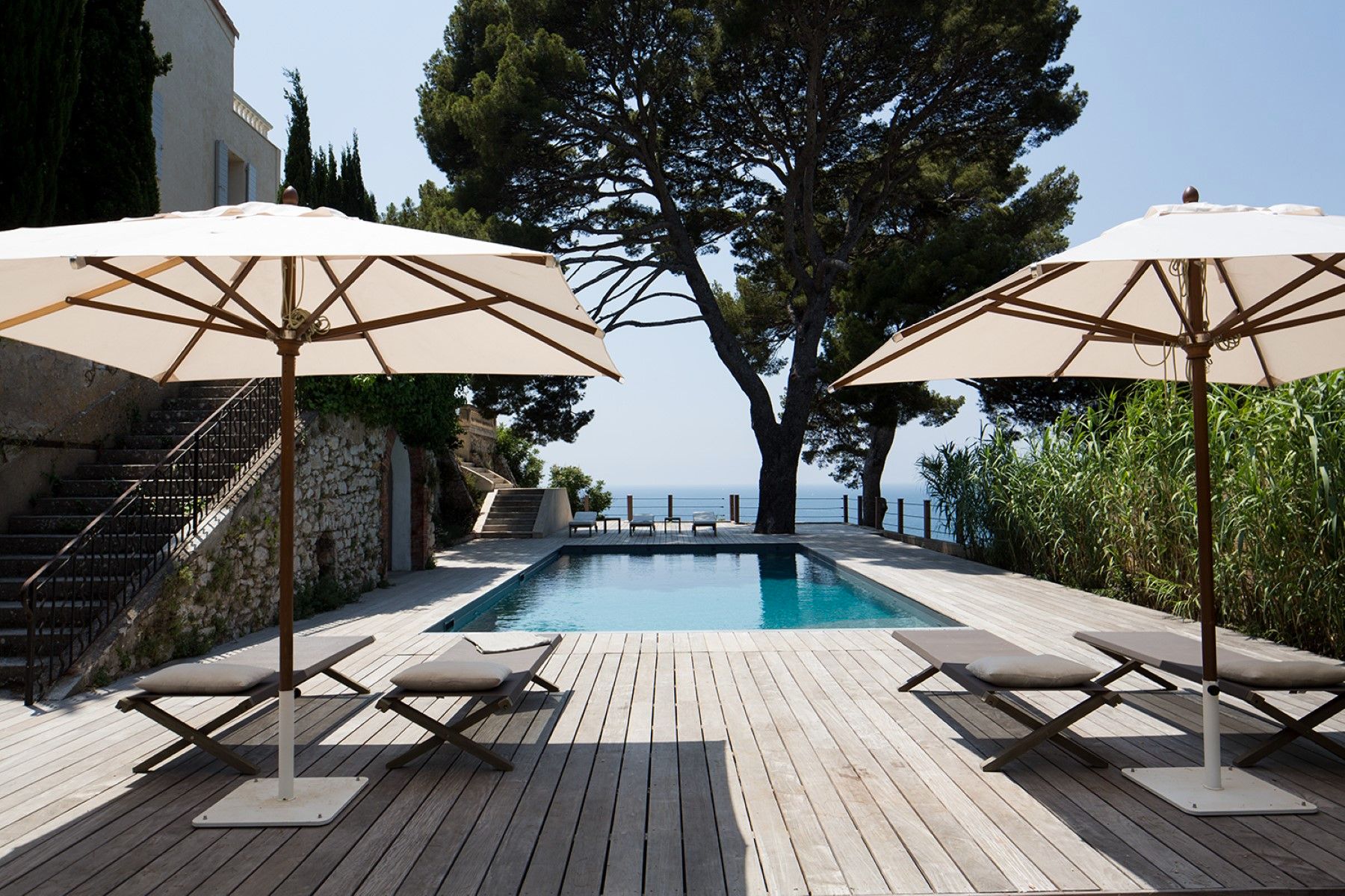 Pool and sunloungers with sea view at Villa Florie in Côte d'Azur