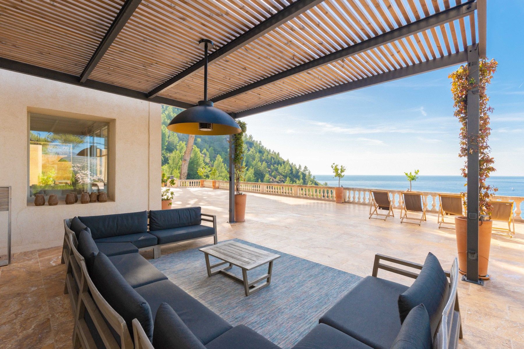 Outdoor seating area with sea view at Villa Florie in Côte d'Azur