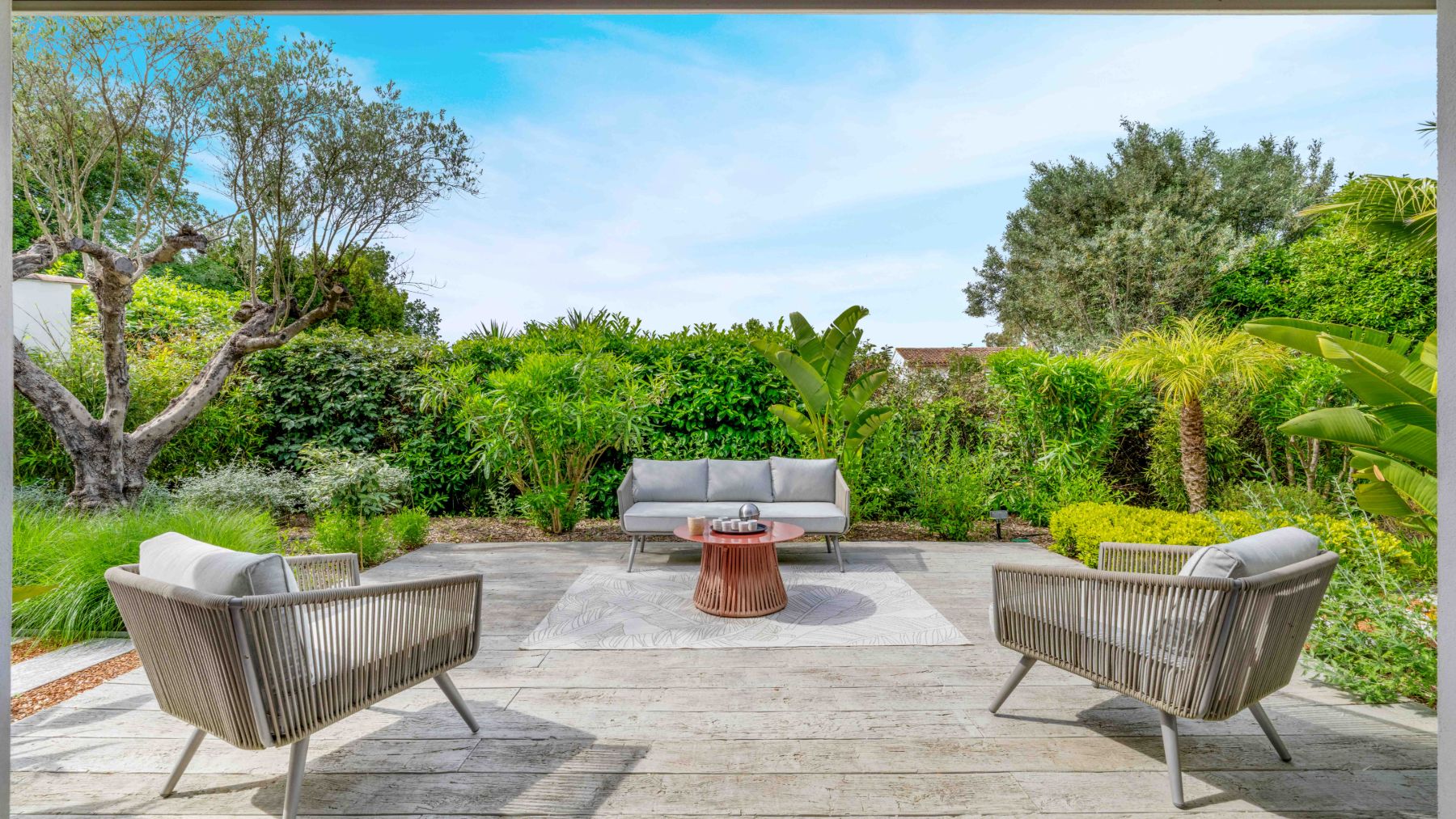 Outdoor seating at Villa Les Palmiers in Cote D'Azur
