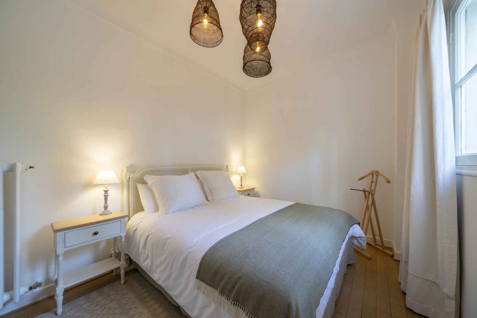 Double bedroom with decorative lamps at French Villa Malvan