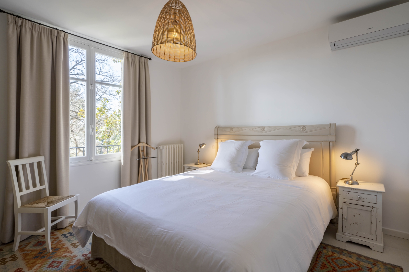 Double bedroom with extensive windows at Villa Malvan, French uxury villa