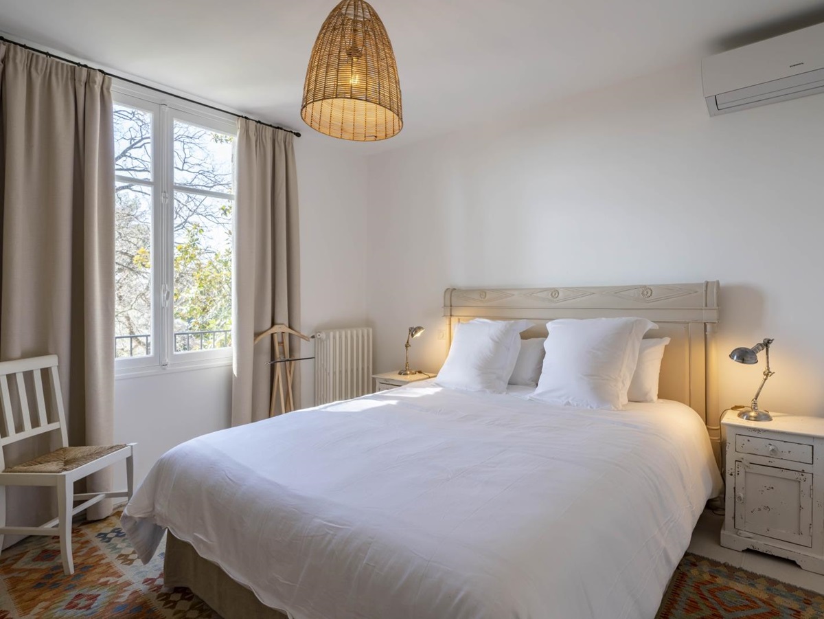 Double bedroom with extensive windows at Villa Malvan, French uxury villa
