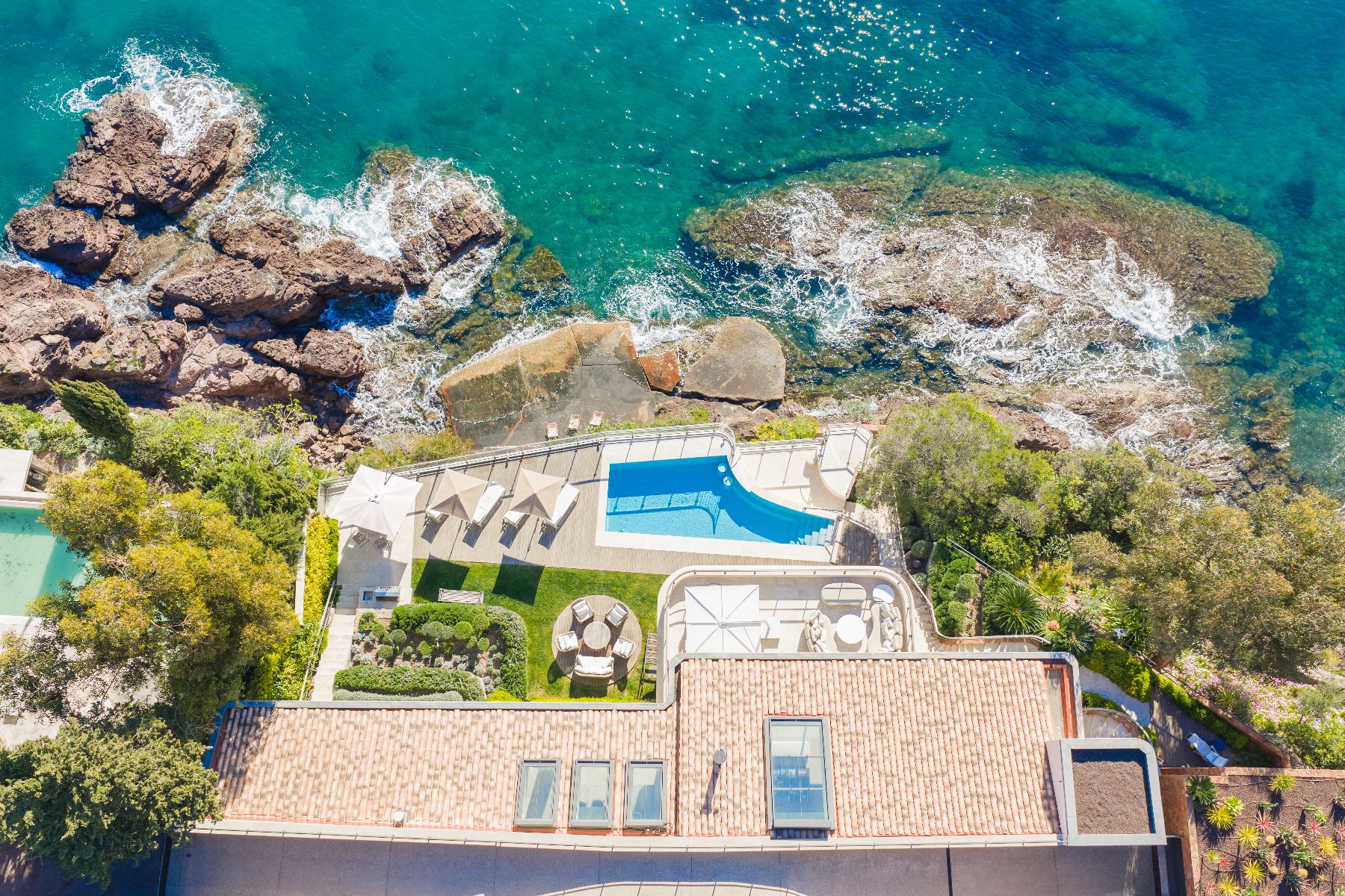 Aerial view of the pool and the private beach at Villa Mathilde in Cote d'Azur