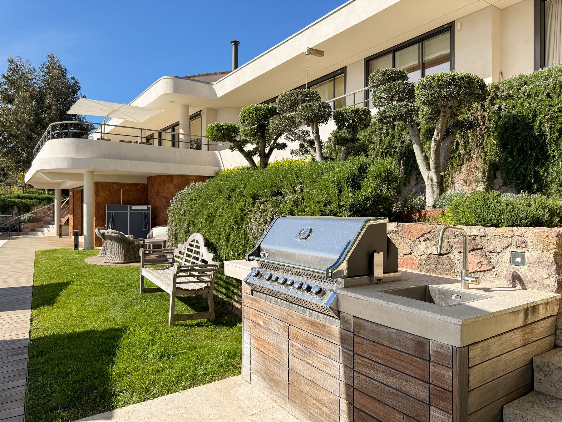 BBQ and bench in the garden at Villa Mathilde in Cote d'Azur