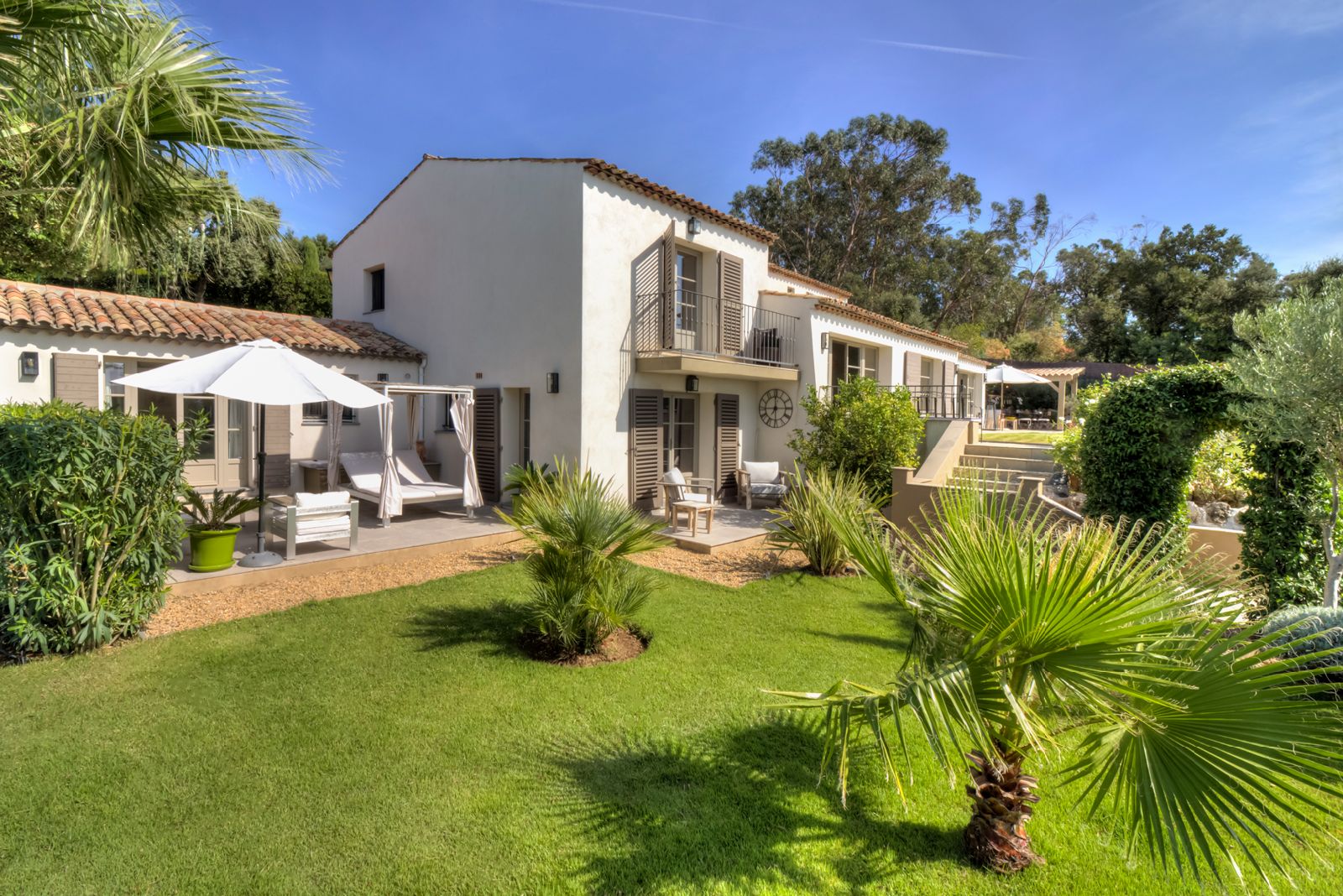 Exterior of property with garden and trees at Villa Zamora on the Cote d'Azur
