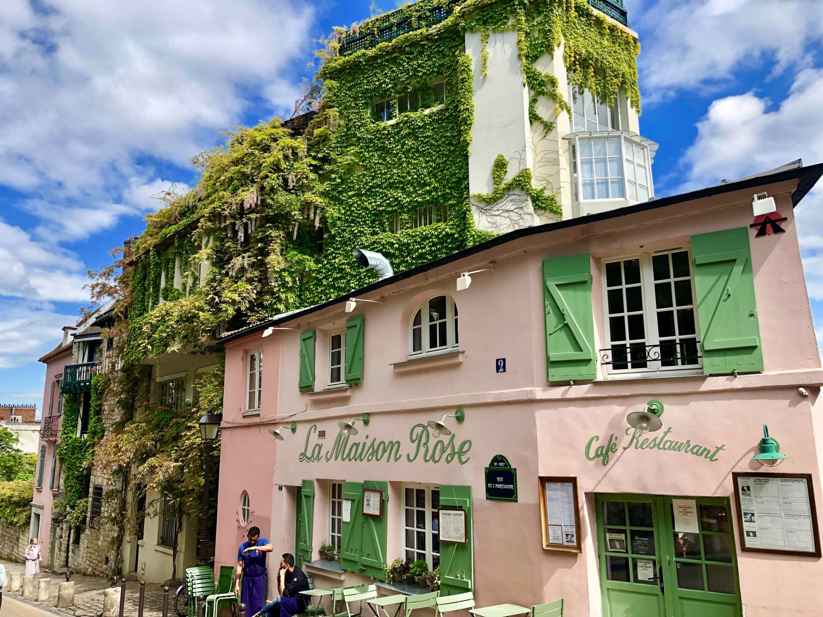 Pink exteriour of the La Maison Rose cafe in Paris