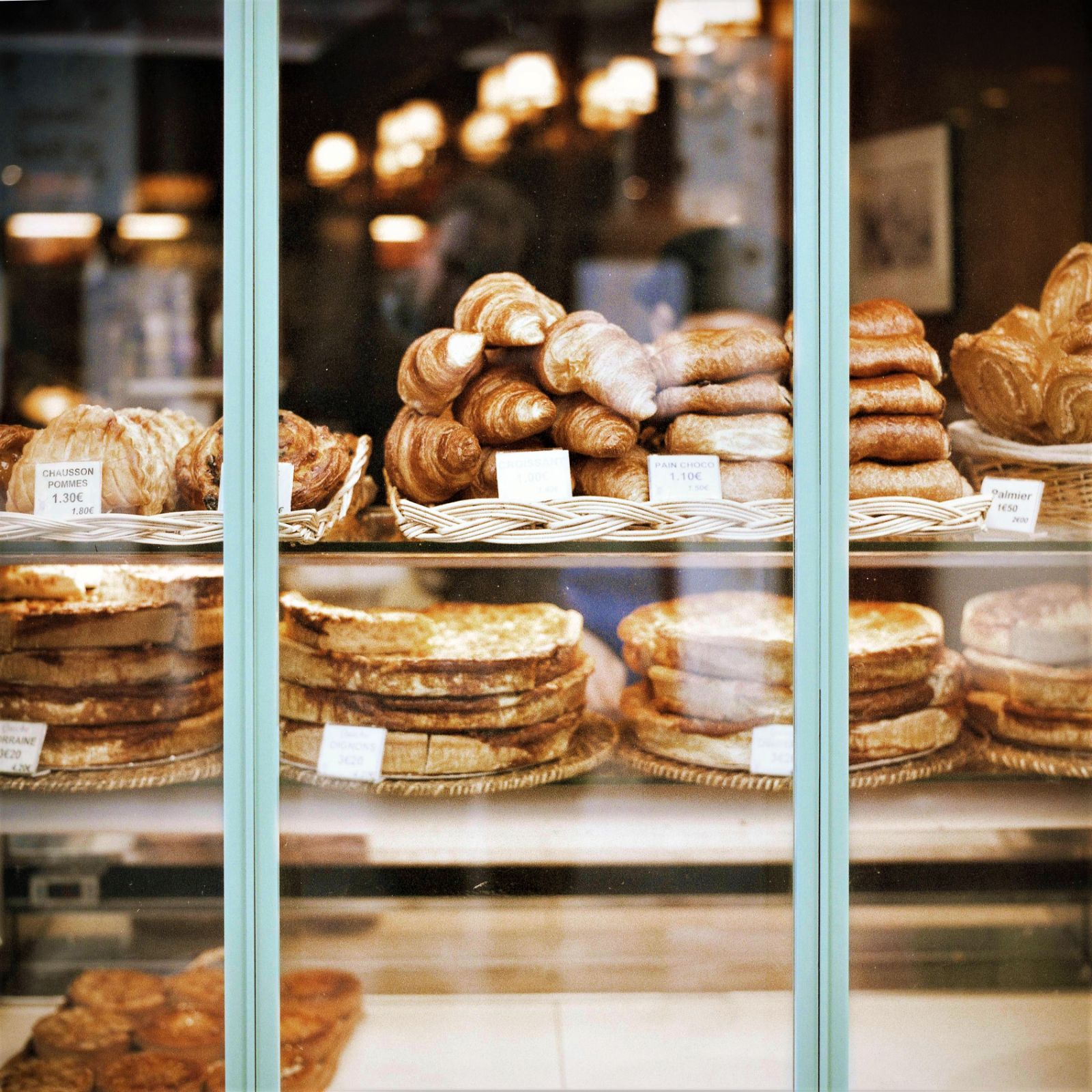 Croissants and pastries in the window of a patisserie