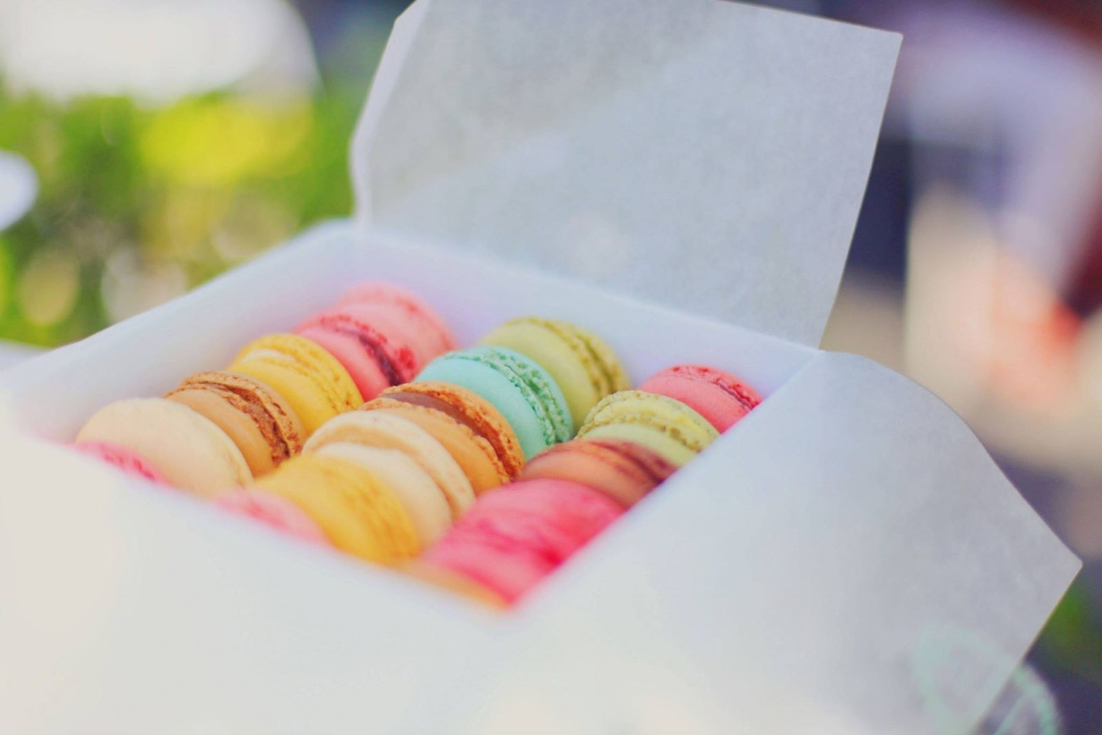 A box of colourful macarons