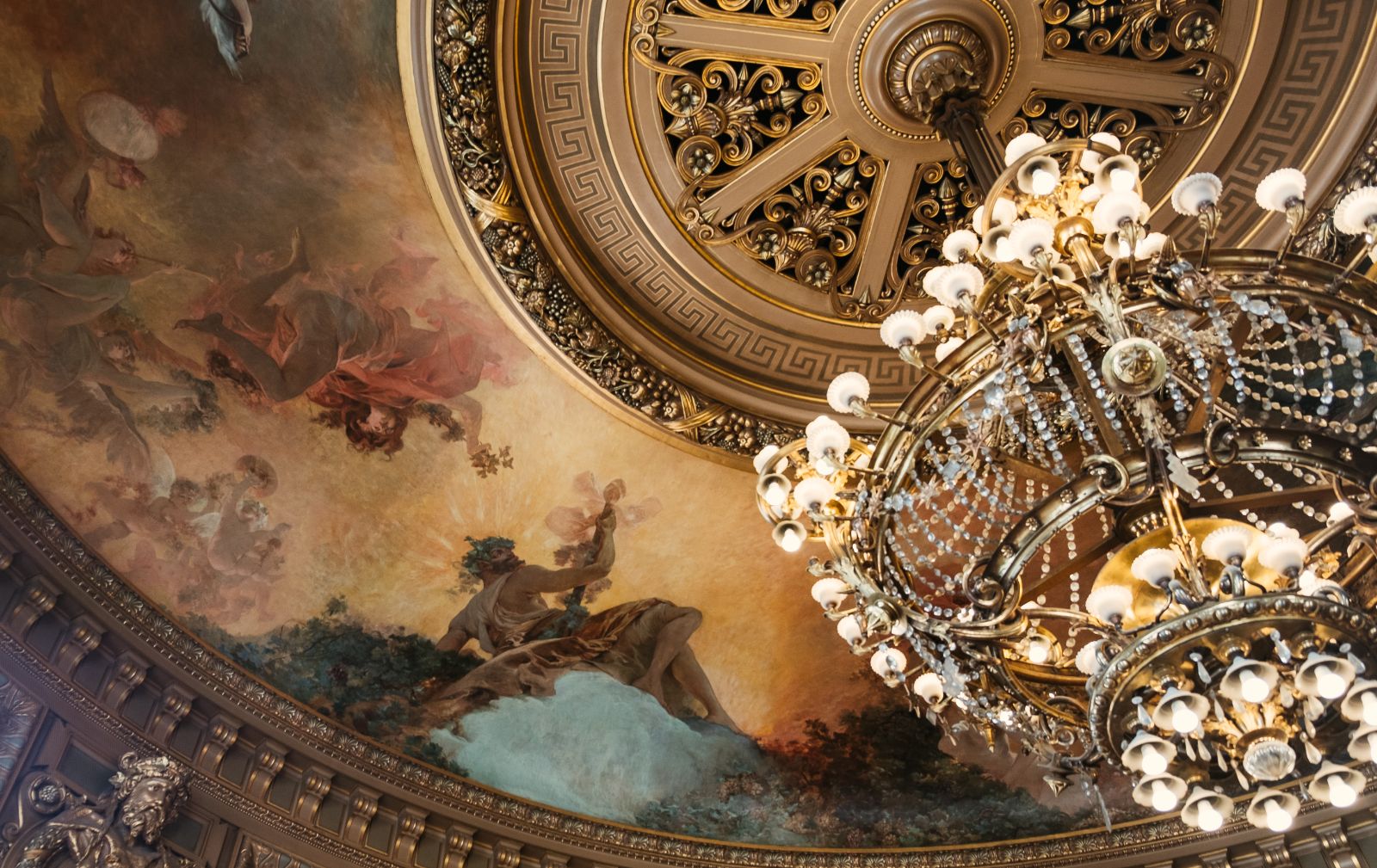Chandelier and painted ceiling at the Palais Garnier opera house in Paris