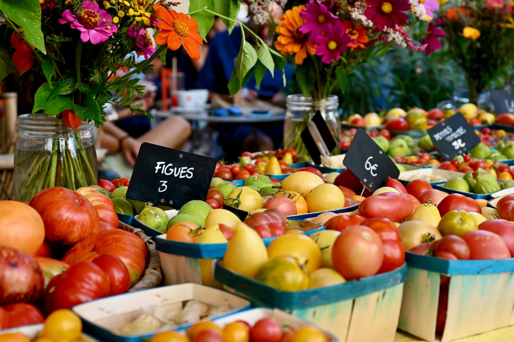 Colourful fruit, vegetable and flowers on display at a French market