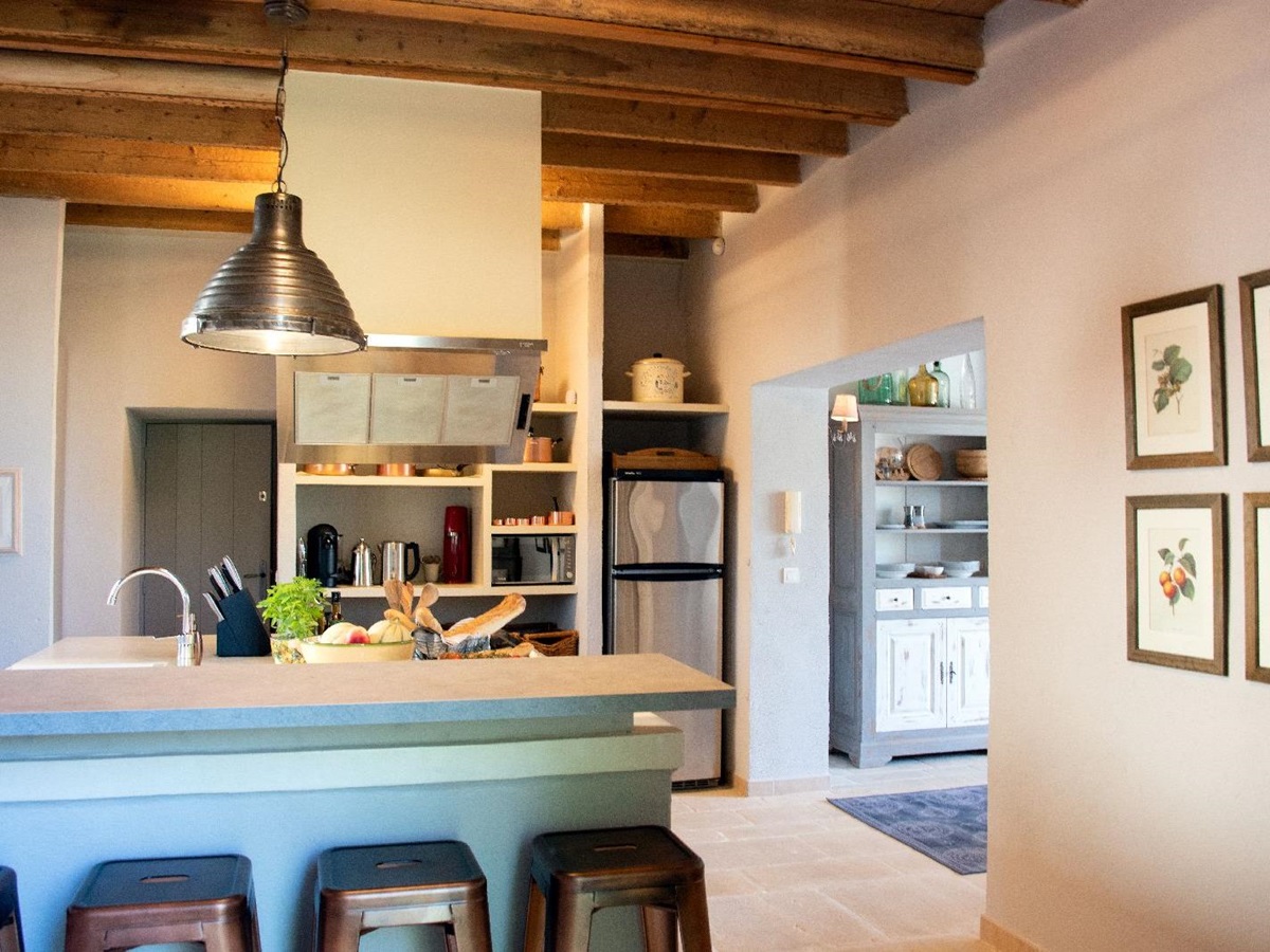Kitchen with bar seating at Bastide d'Aristide in Provence