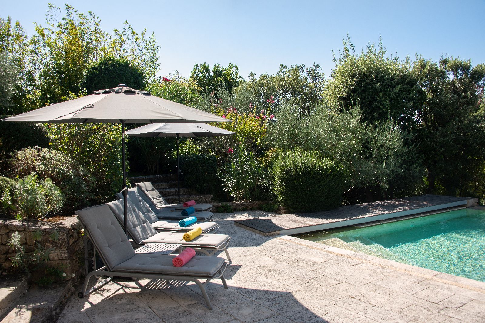 Sun loungers by the pool at Bastide d'Aristide in Provence