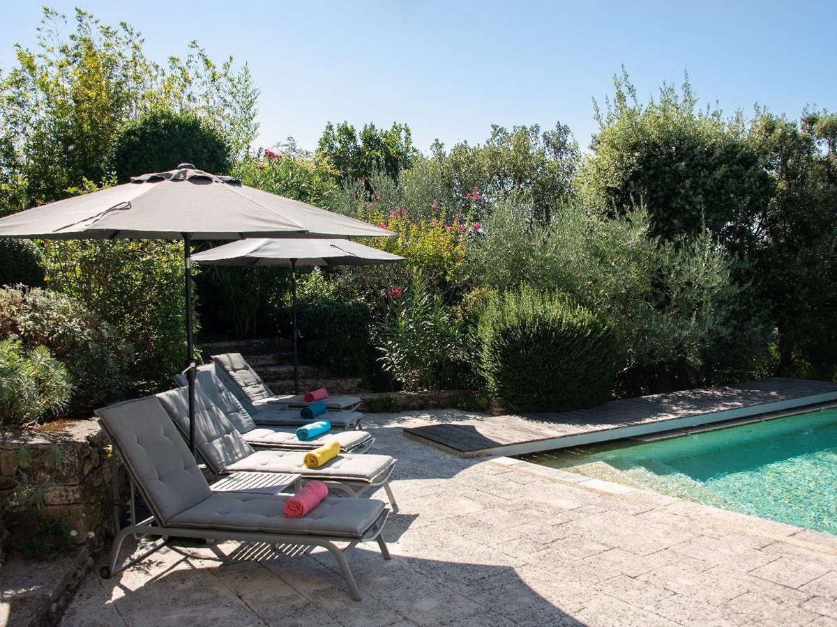 Sun loungers by the pool at Bastide d'Aristide in Provence