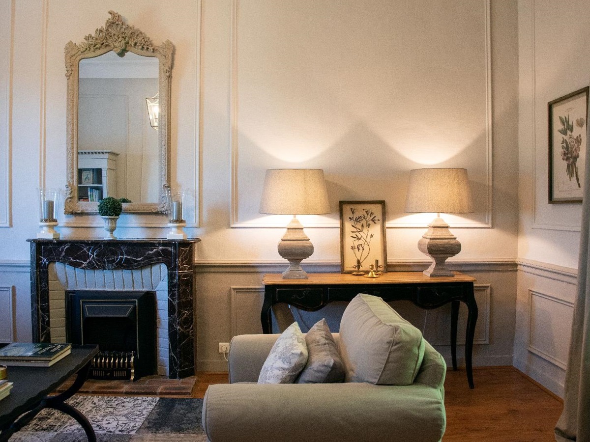 Sitting room with comfy green chair at Bastide d'Aristide in Provence