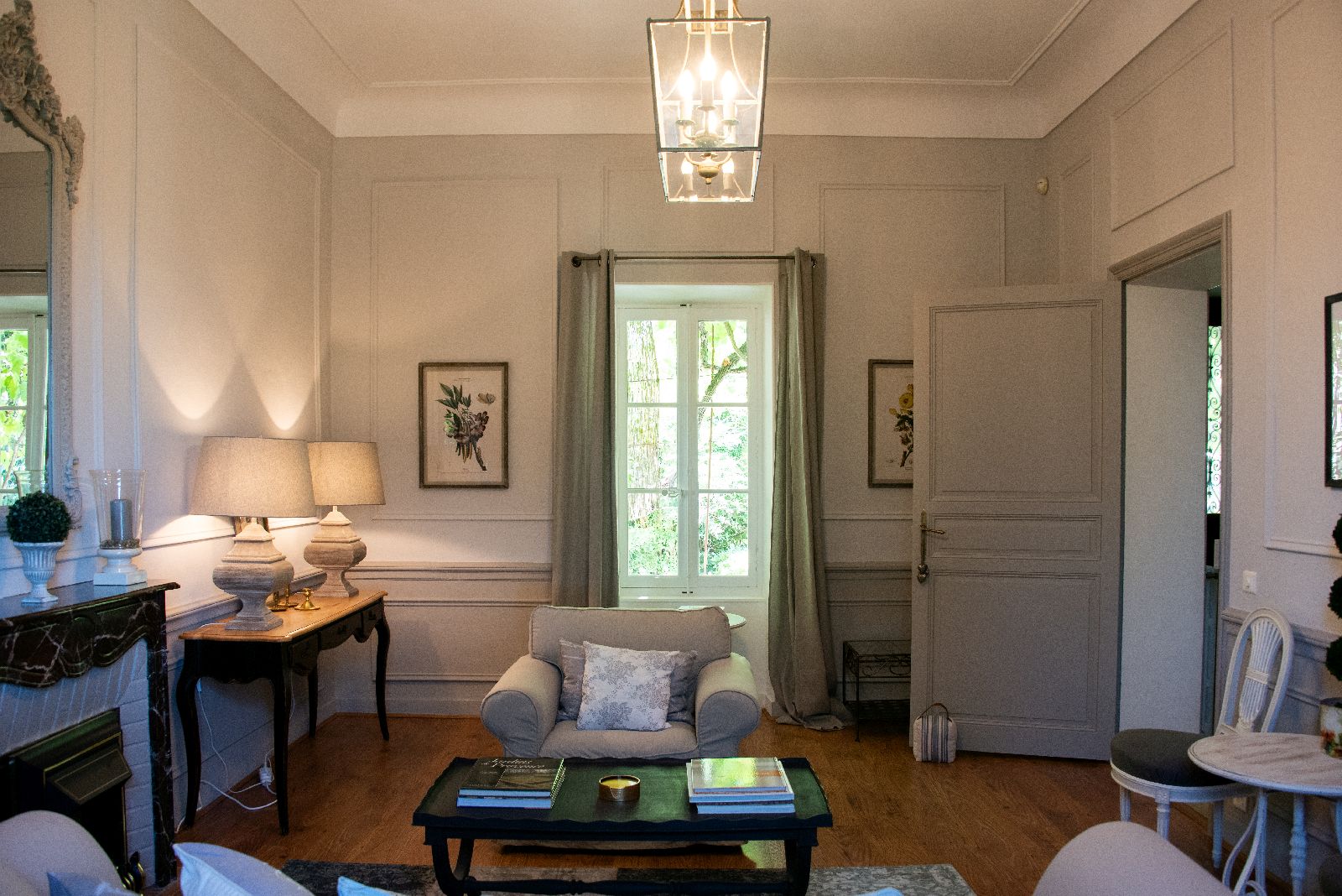 Sitting room with large window at Bastide d'Aristide in Provence