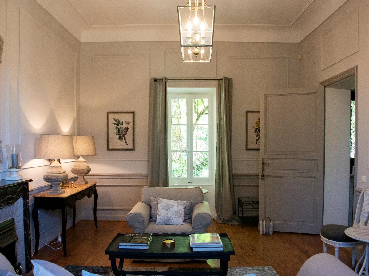 Sitting room with large window at Bastide d'Aristide in Provence