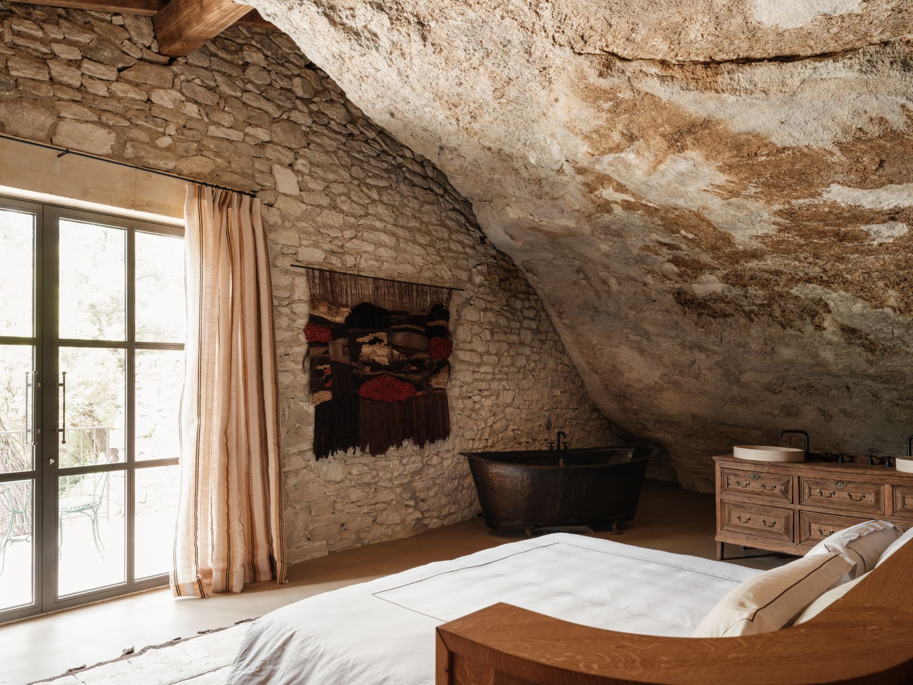 Bedroom One and Feature Cliff wall at La Bergerie de Calabrun in Provence