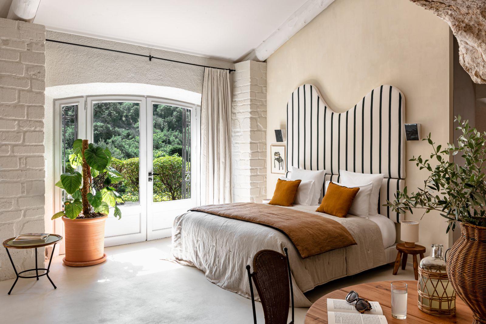 bedroom with striped headboard
