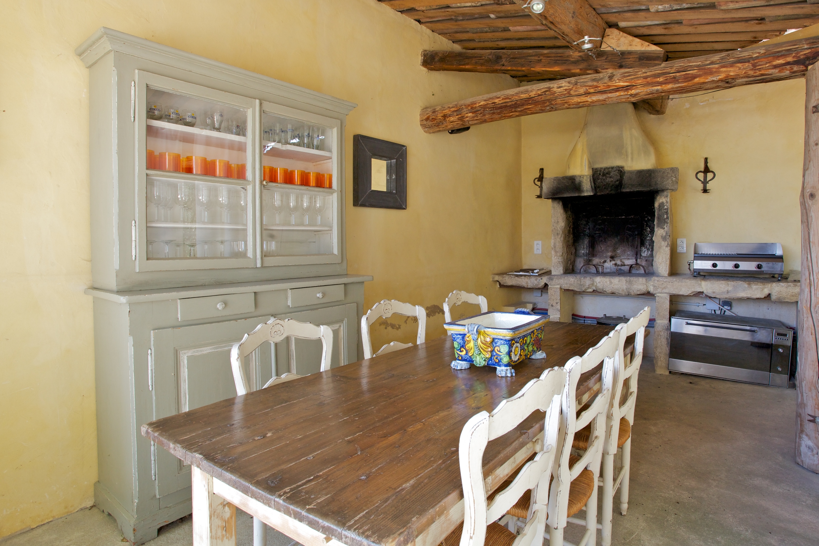 seating area with fireplace in Le Pont Romain, Provence