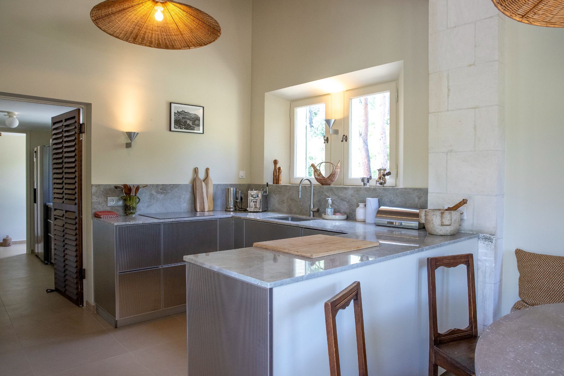 Contemporary kitchen in grey and white at Maison Les Baux in Provence, France