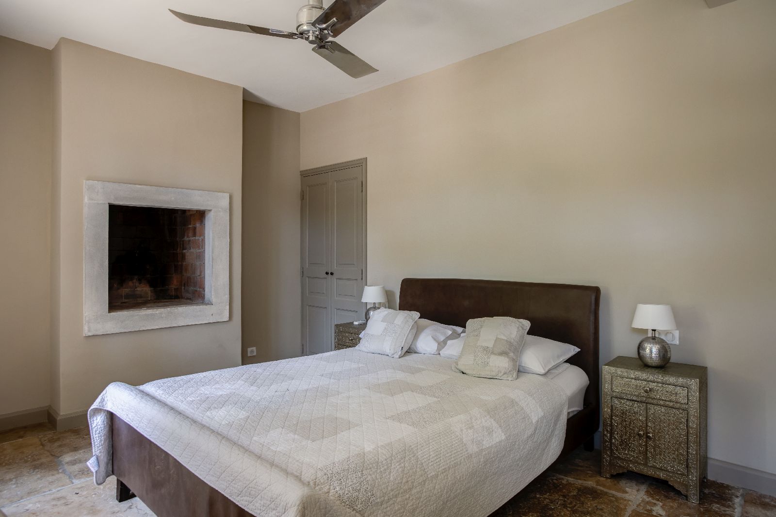 Double bed with wooden frame at Mas Calanquet in Provence