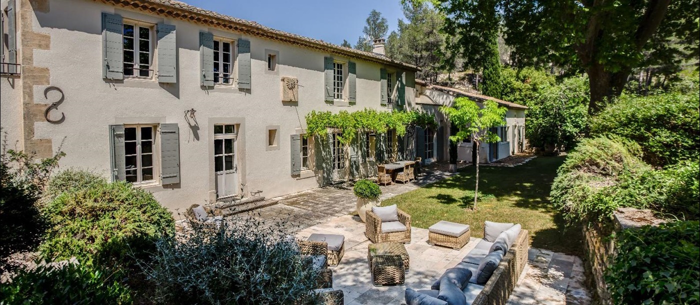 Exterior of villa with outdoor seating at Mas Calanquet in Provence