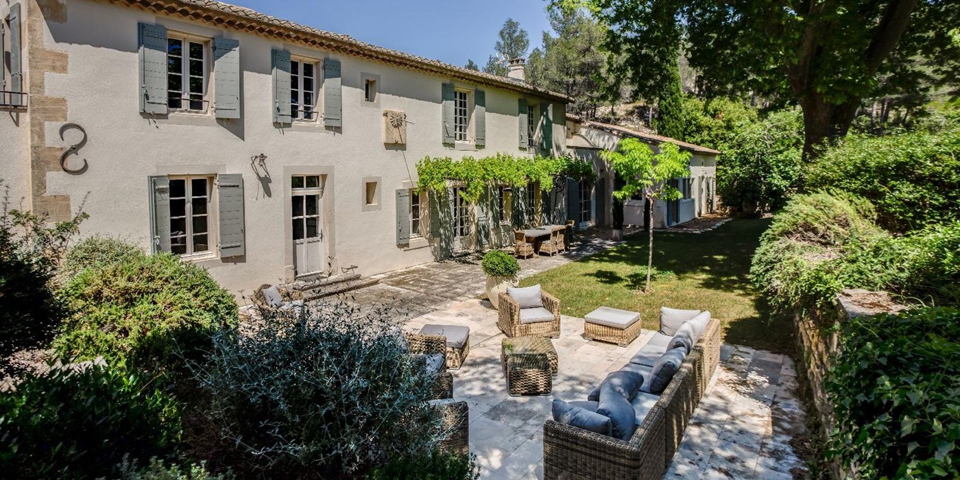 Exterior of villa with outdoor seating at Mas Calanquet in Provence