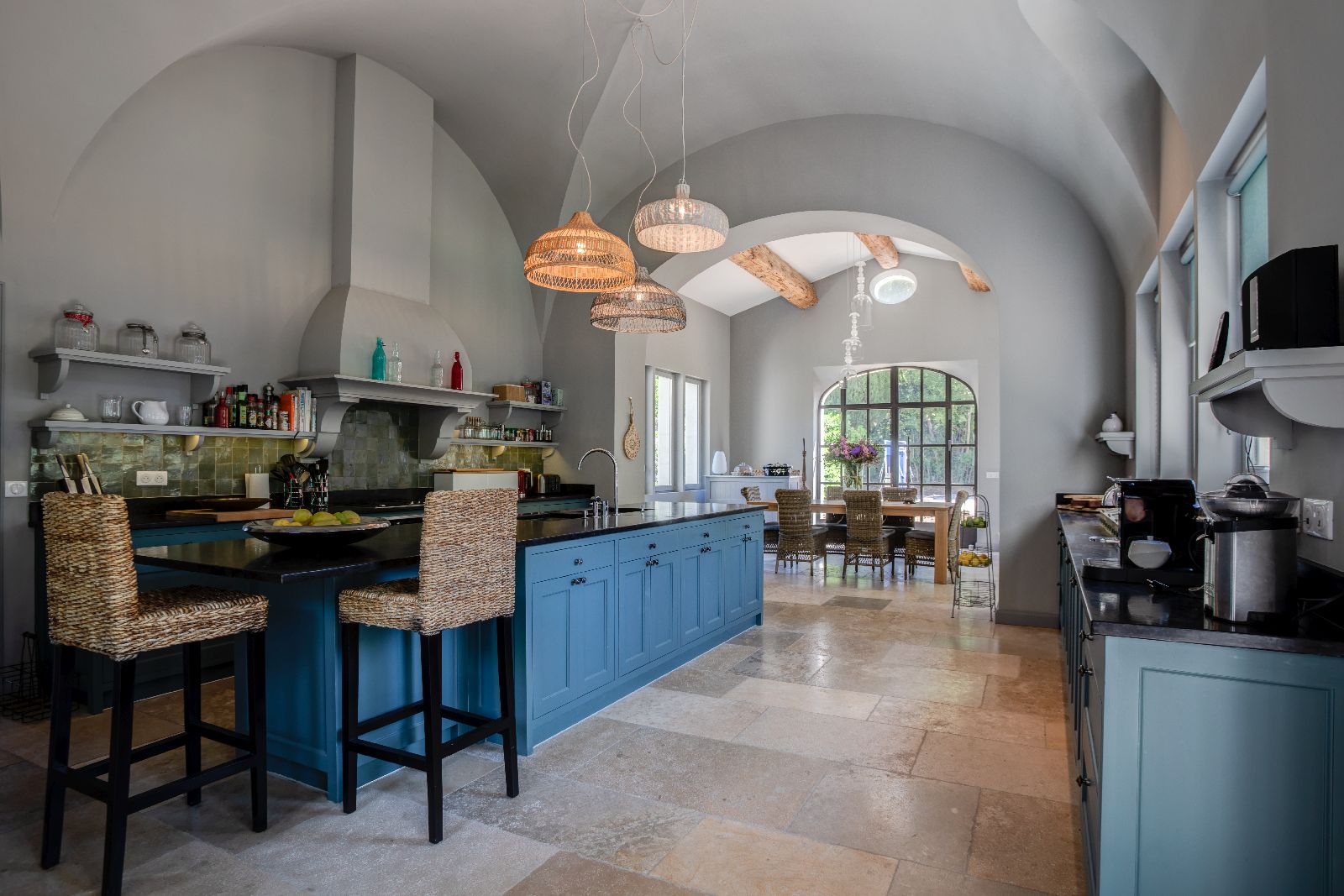 Kitchen with seating area and arched ceiling at Mas Calanquet in Provence