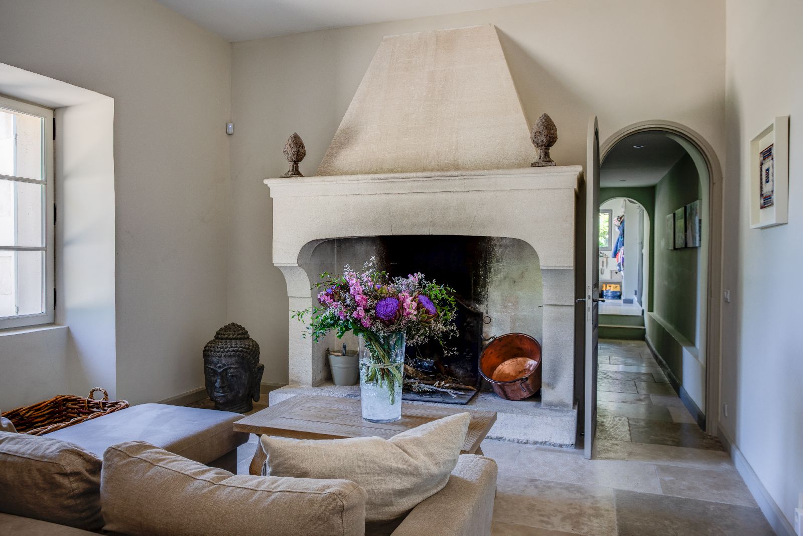 Living room with fireplace at Mas Calanquet in Provence