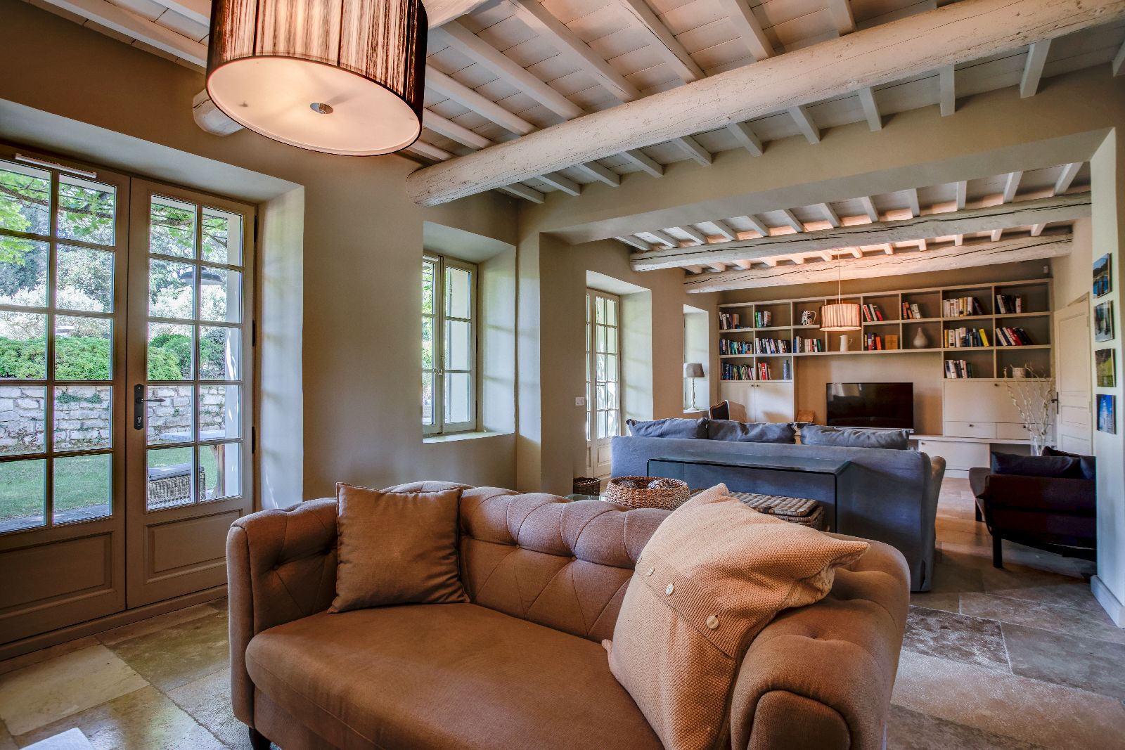 Living room with beamed ceiling at Mas Calanquet in Provence