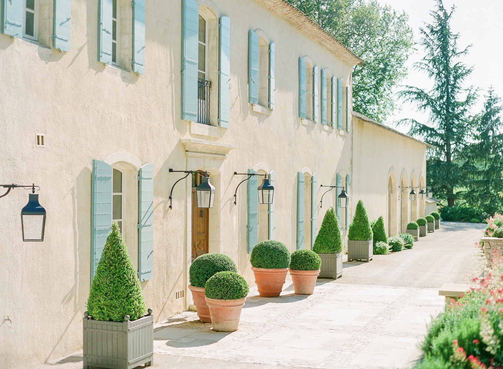 Façade of villa, lanterns and plants at Mas de la Motte in Provence, France