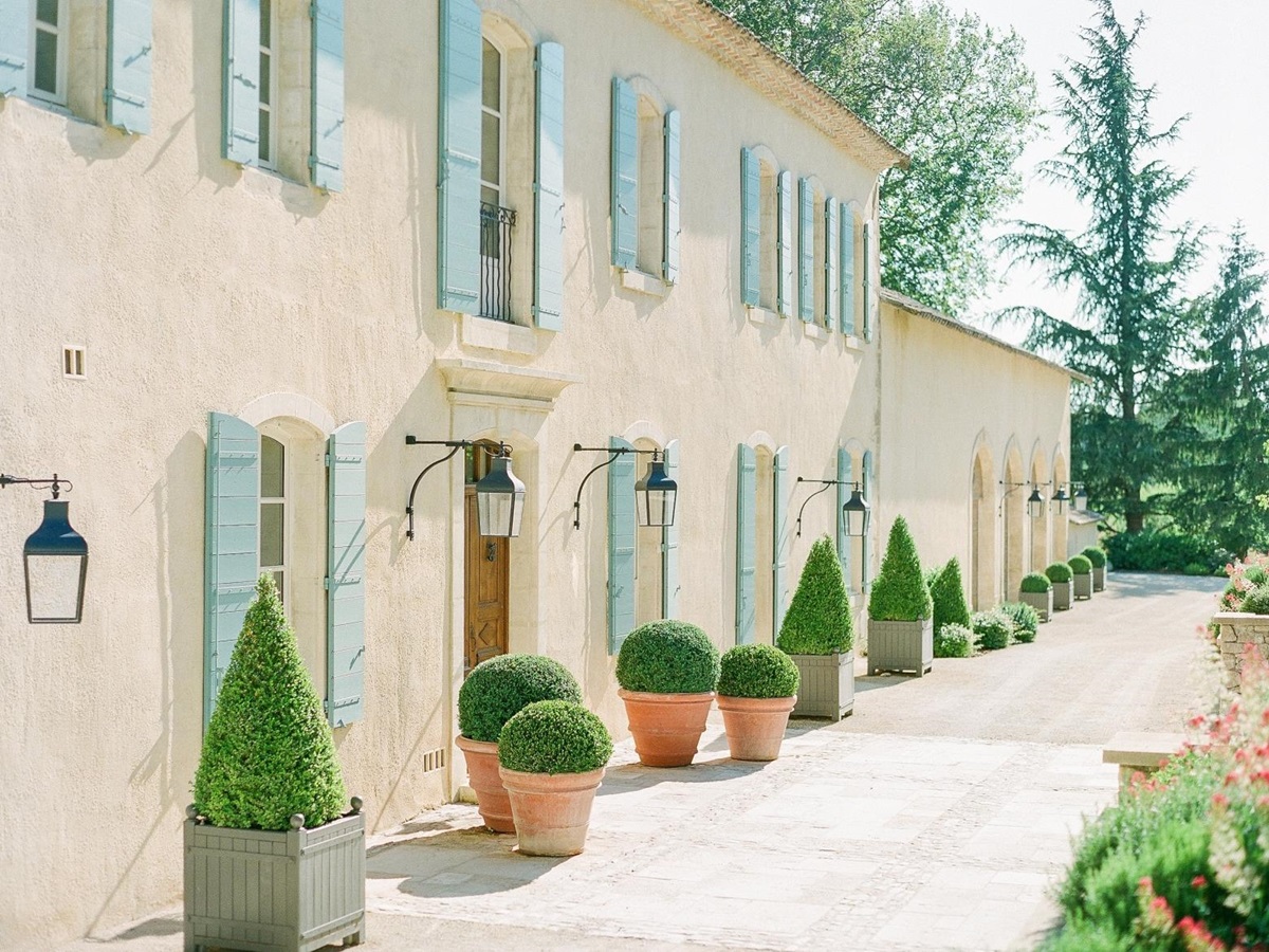Façade of villa, lanterns and plants at Mas de la Motte in Provence, France