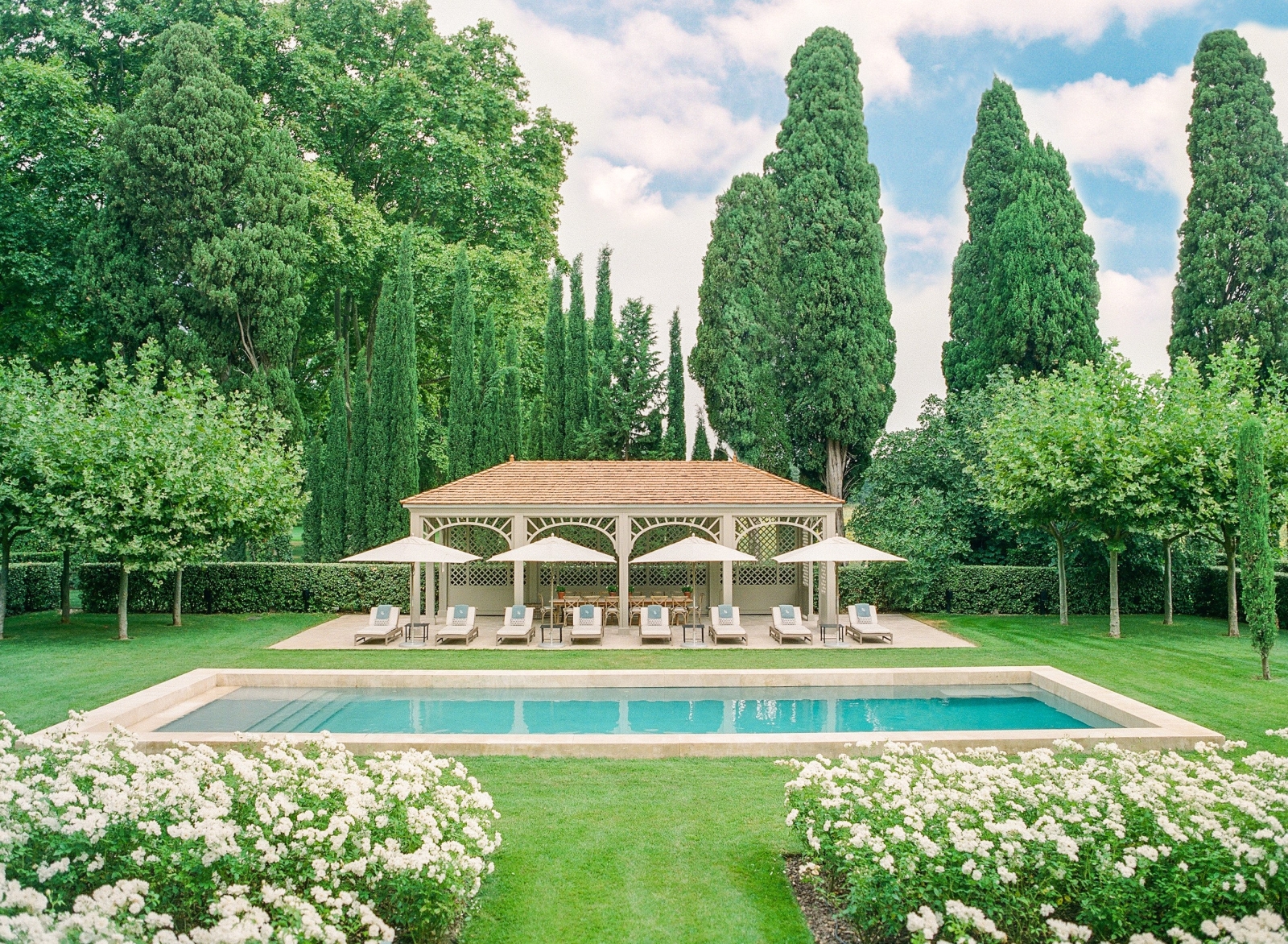 Pool house from front angle with loungers at Mas de la Motte in Provence