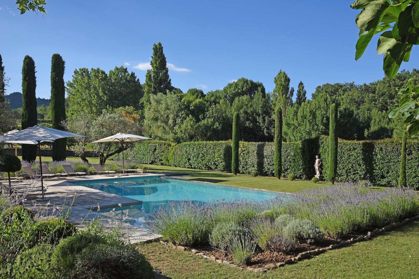 Swimming pool with garden at Mas des Cerisiers, Provence