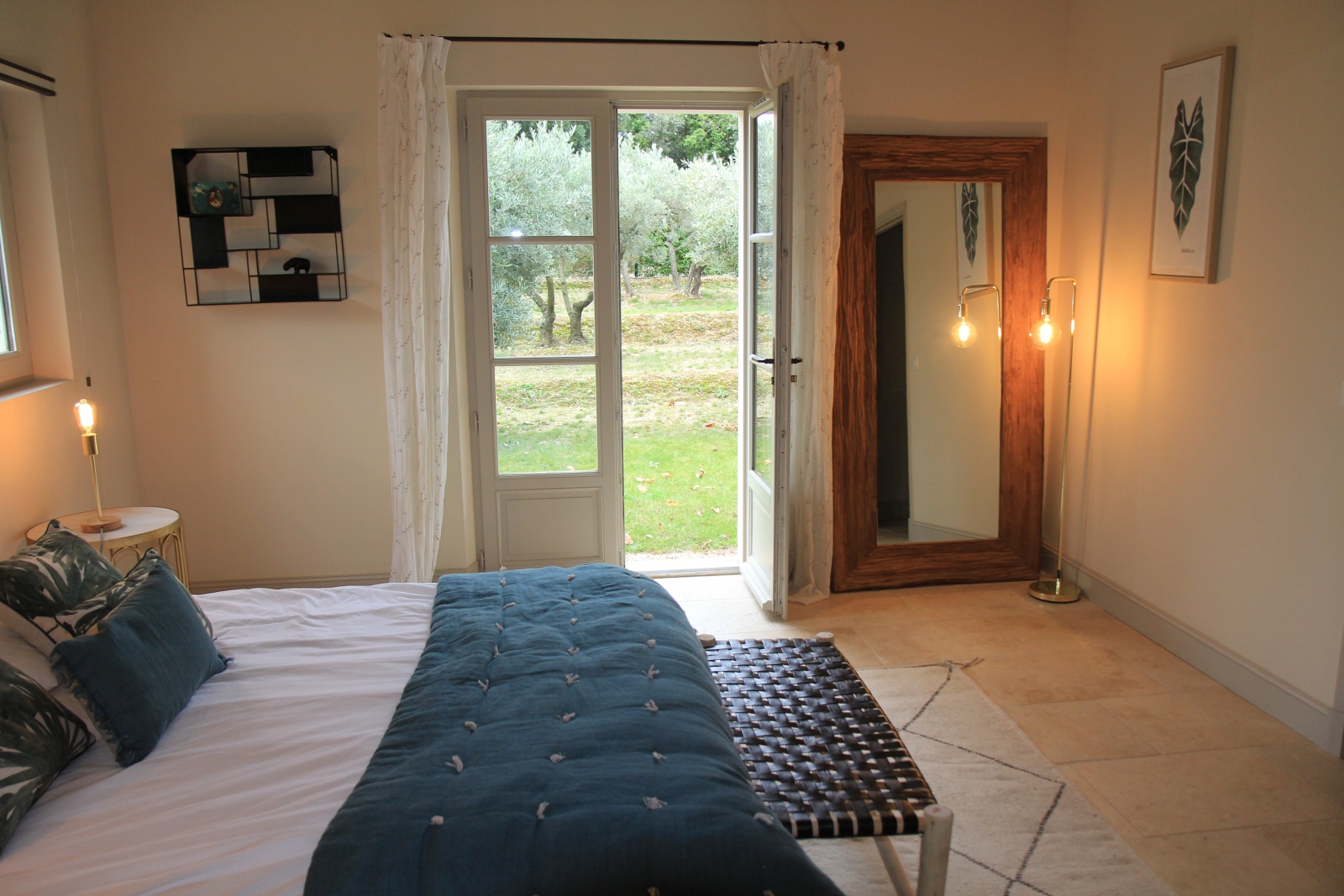 Double bedroom with large french doors leading to garden at Mas Eygalieres in Provence