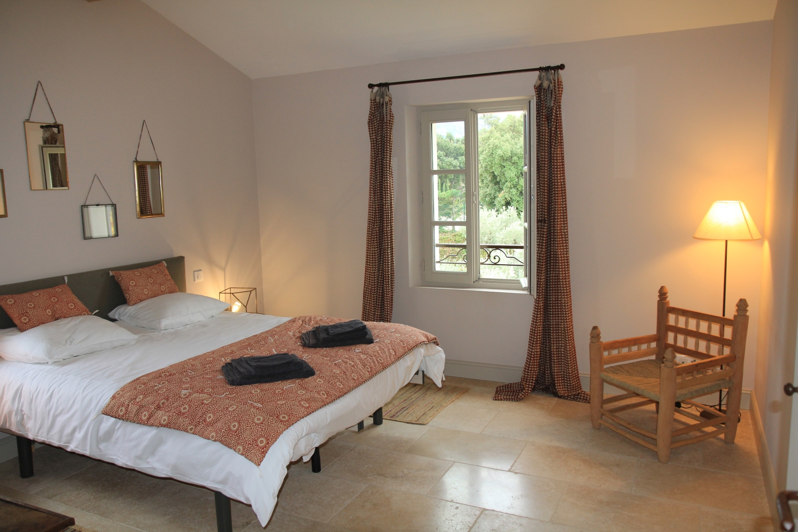 Double bedroom with pink blanket at Mas Eygalieres in Provence