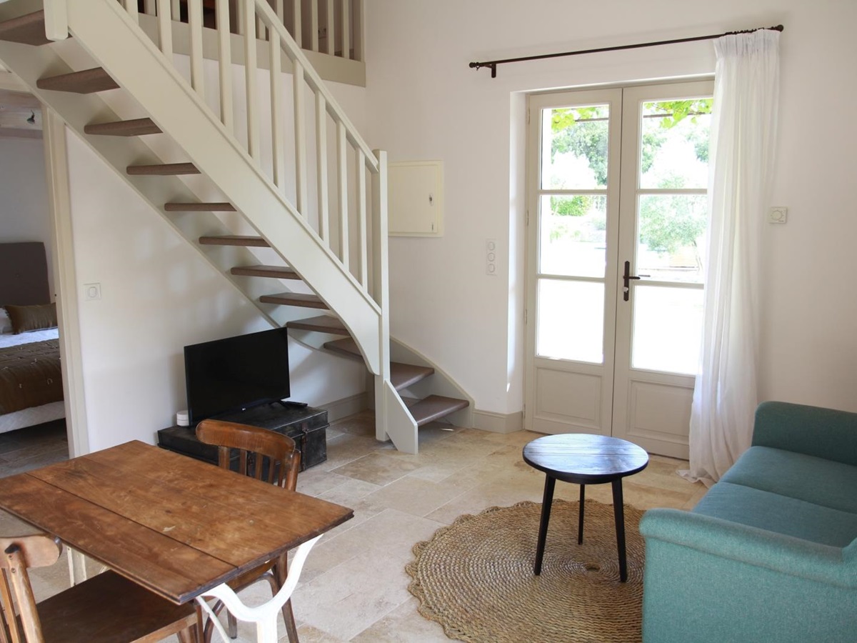 Guest house living room with french doors at Mas Eygalieres in Provence