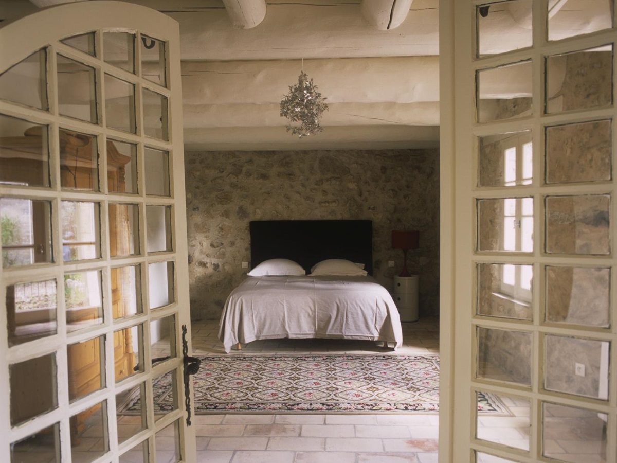 Double bedroom seen through entrance in Mas Jaisses, Provence